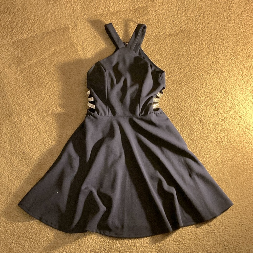 This juniors navy semi formal dress was altered to fit size 0. Worn once.